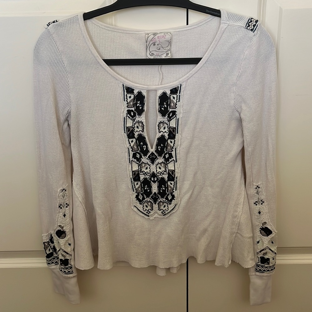 Size small Free People white ripped white sleeve with embroidery